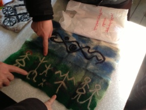 Participants share the symbols in the felt they made in the workshop